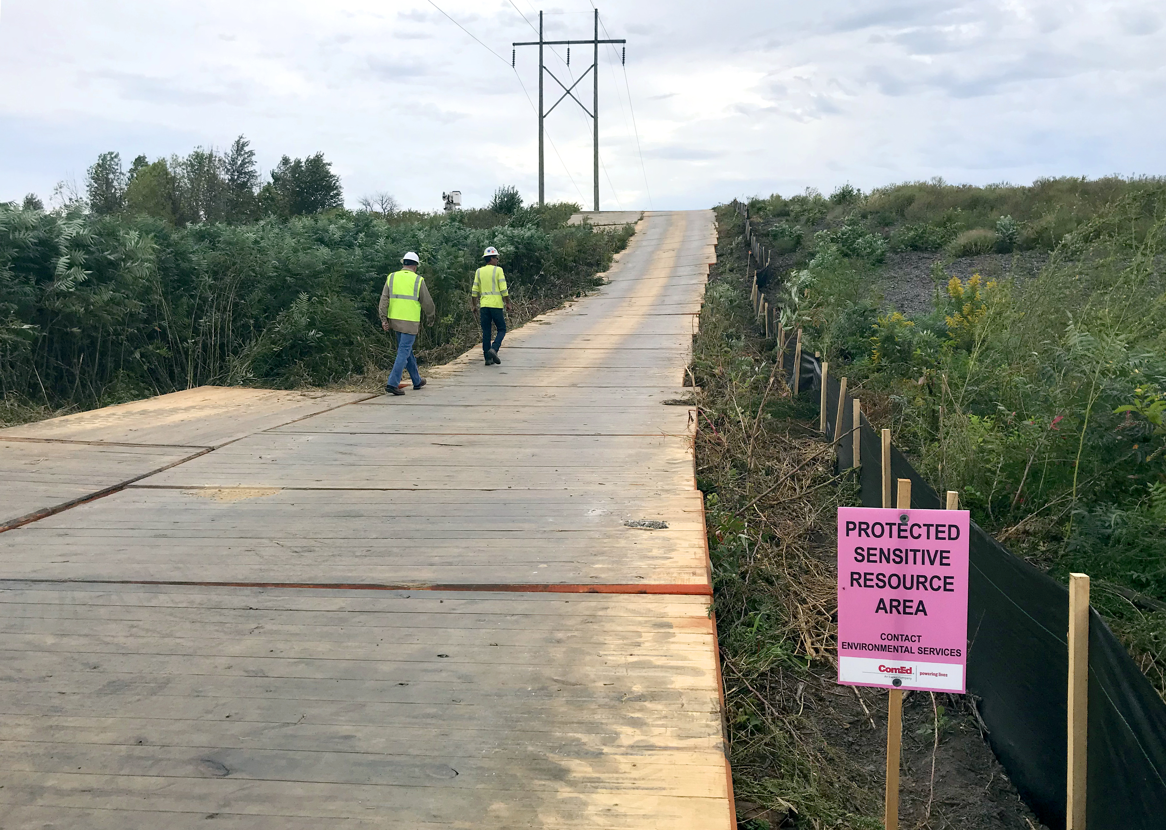 Ground protection mats creating stable site access for transmission infrastructure projec