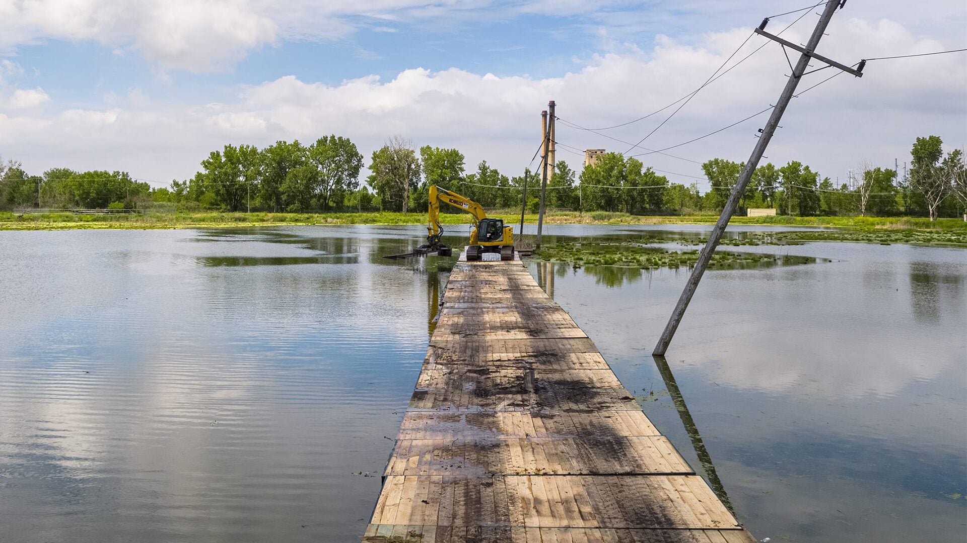 Ground protection mats creating stable site access for transmission infrastructure projec